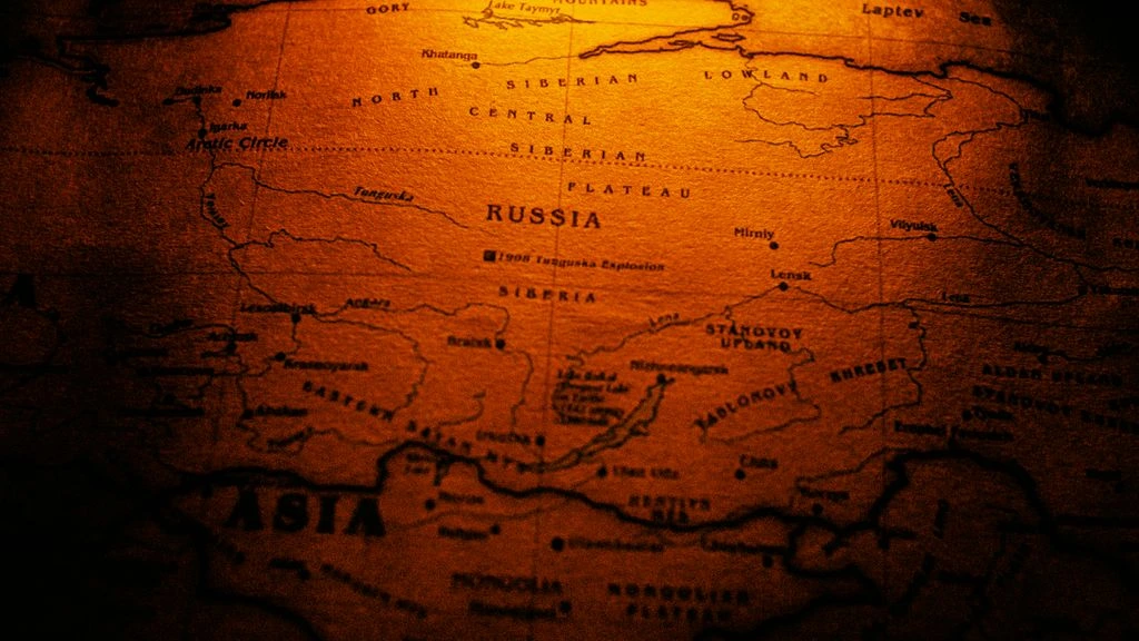Editorial duotone world map with pins marking Zetamu's San Francisco, Lisbon, and Singapore operating regions.